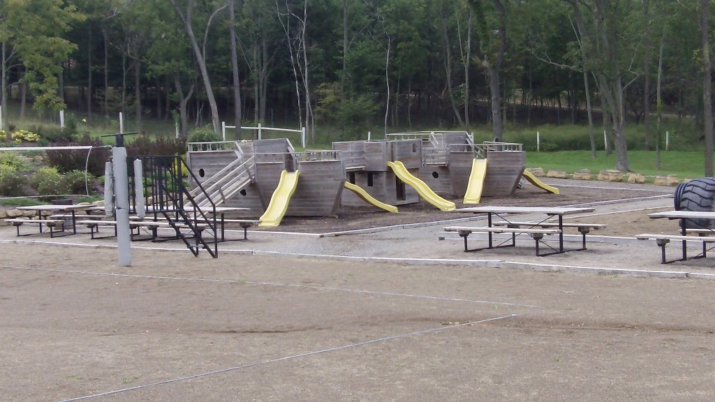 An "arc" themed playground, picnic area and sand-volleyball courts.