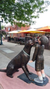 sculpture of puppy licking boy's face in Sioux Falls South Dakota