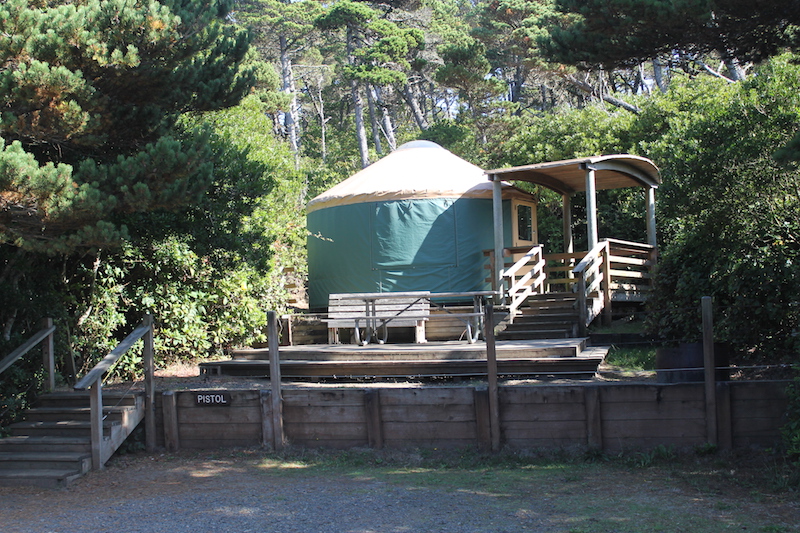 family camping in a yurt