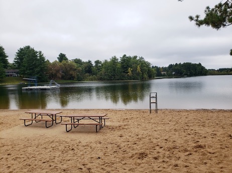 Picnic tables and swimming docks for a fun afternoon at South Park beach. Photo by Leia Cullen