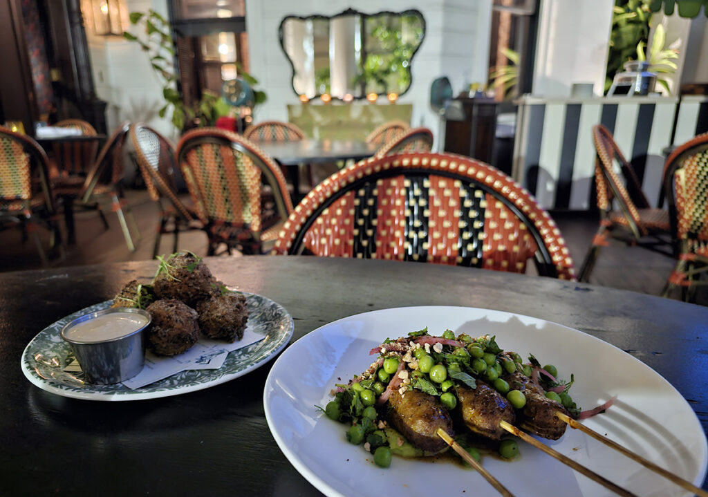 Hushpuppies and lamb skewers to start dinner on the porch of the Columns Restaurant and Bar